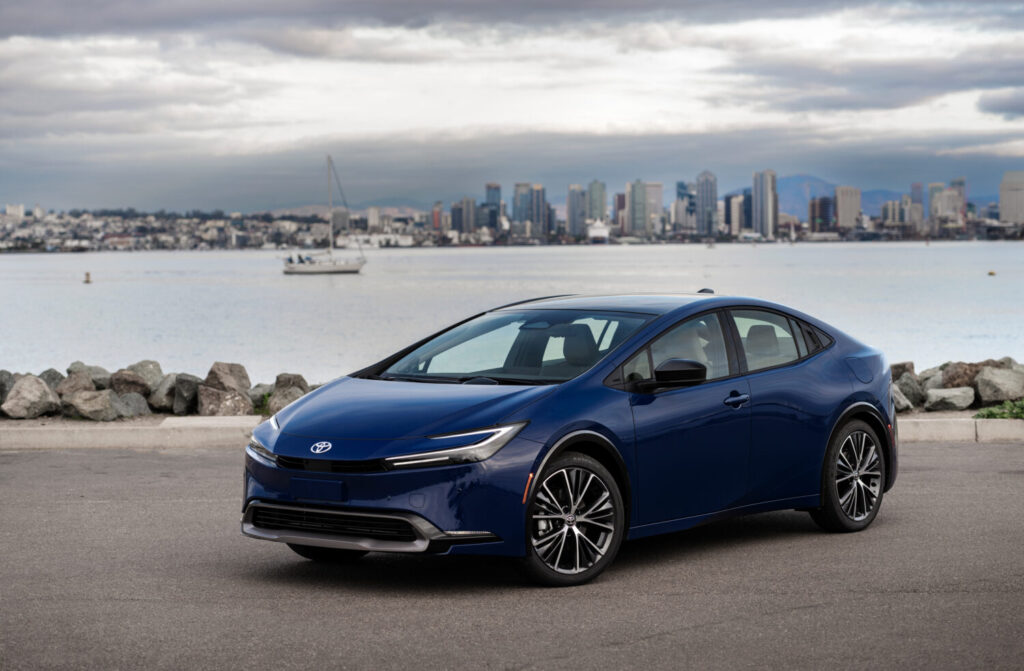 2026 Toyota Prius in a reservoir, Blue by the side of a reservoir
