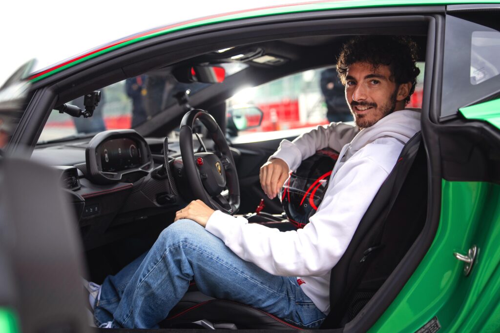 Francesco ‘Pecco’ Bagnaia sits inside the Lamborghini
