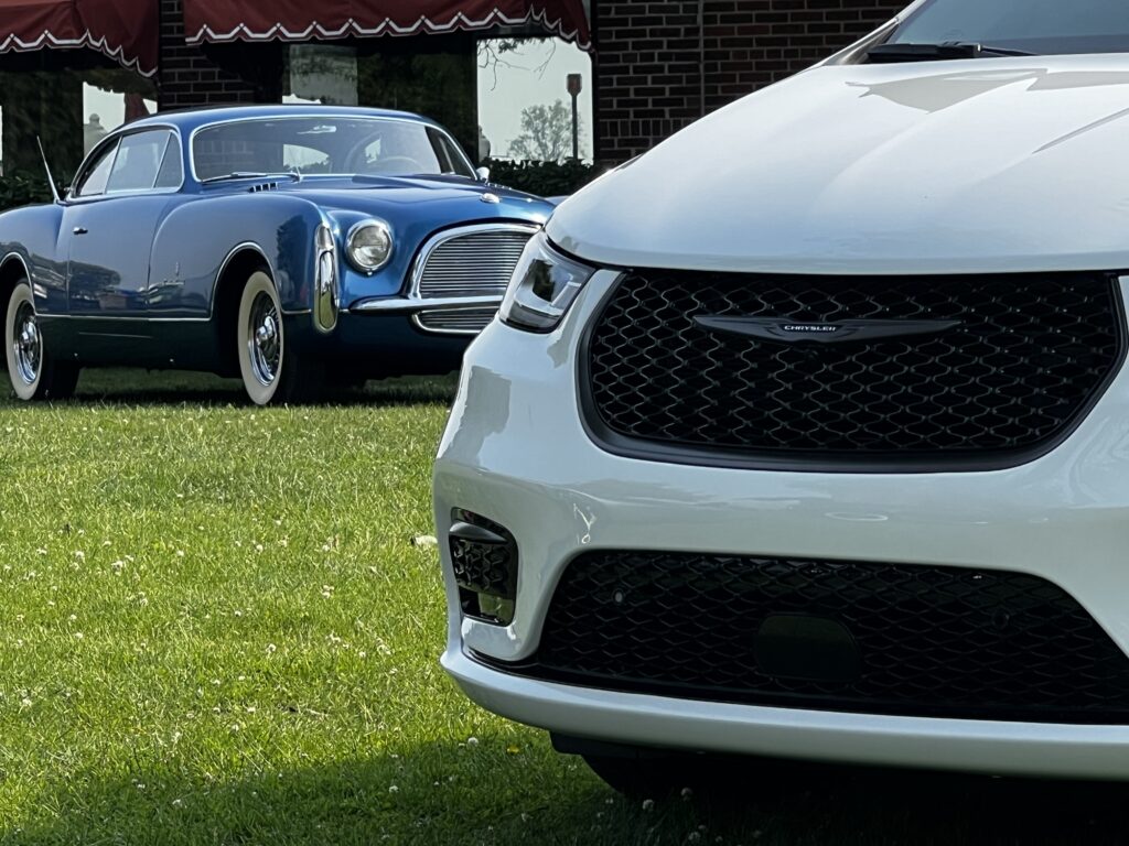 Front end of Chrysler Pacifica with Chrysler concept car in the background