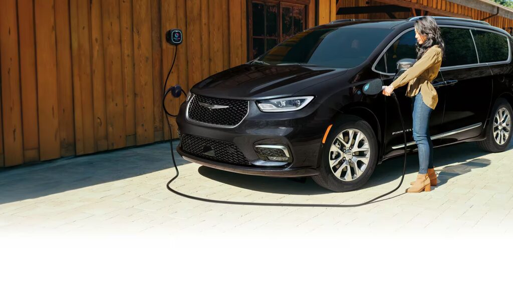 2025 Chrysler Pacifica minivan plugged in and charging