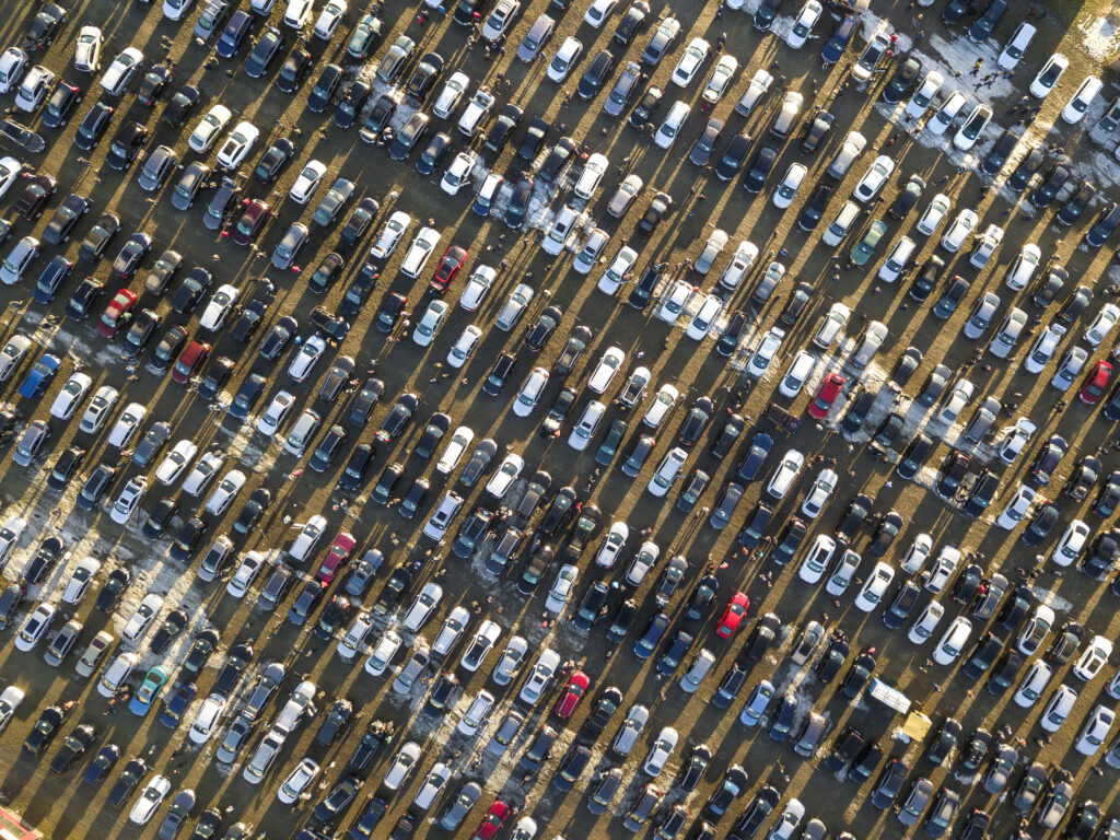 Aerial view of car lot with thousands of cars for sale