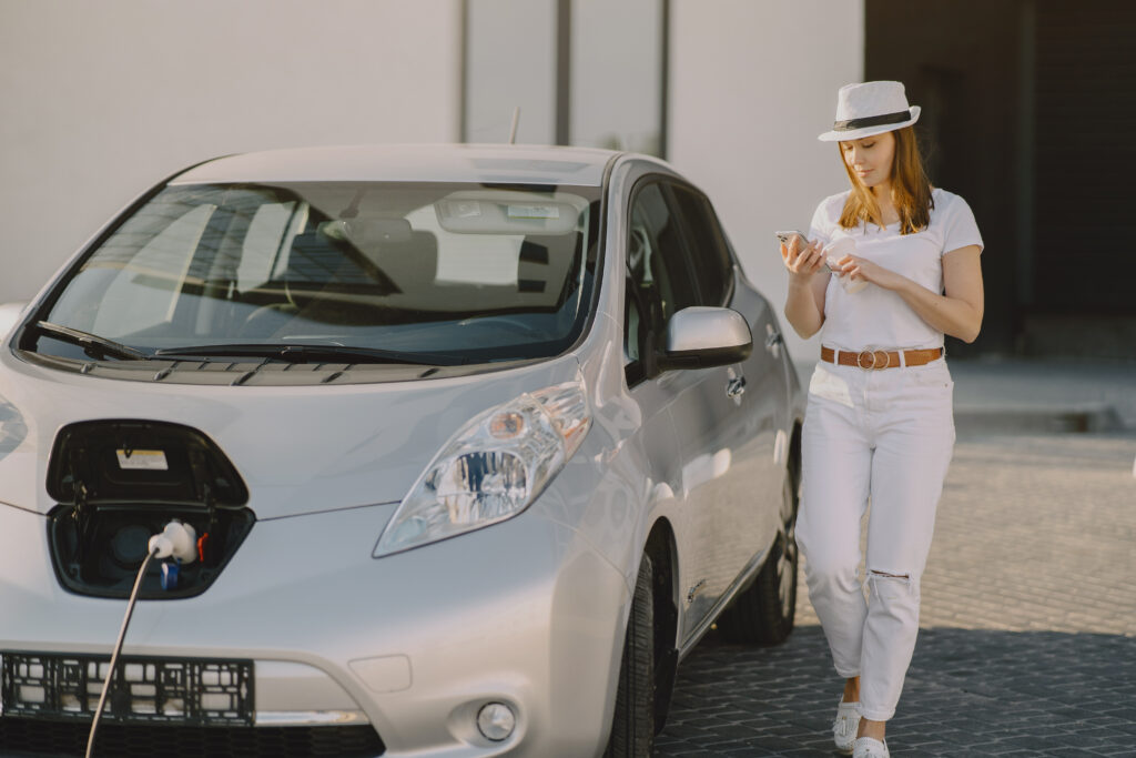 Woman with Nissan Leaf