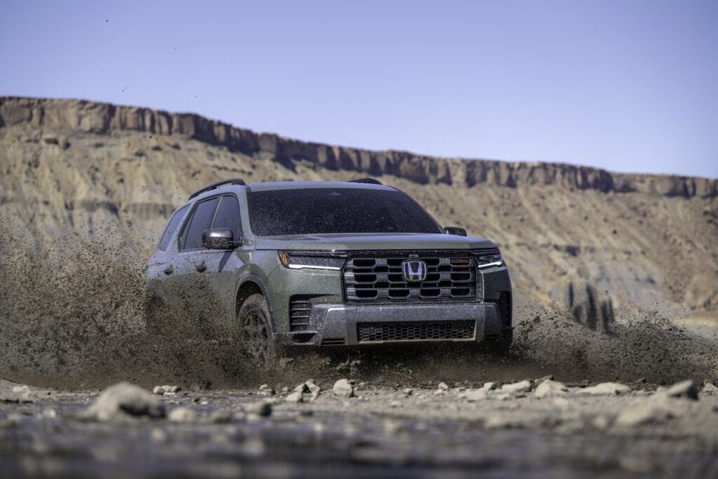 2026 Honda Pilot TrailSport driving through mud