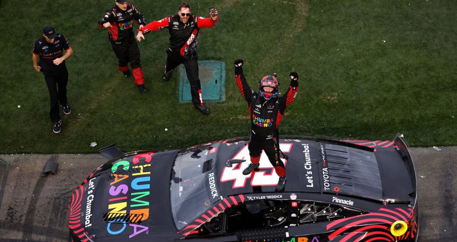 Tyler Reddick Wins 2026 Nascar's Daytona 500 standing on the top of his car