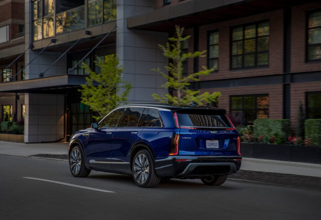 Rear 3/4 view of the 2026 Cadillac VISTIQ Premium Luxury in Opulent Blue.