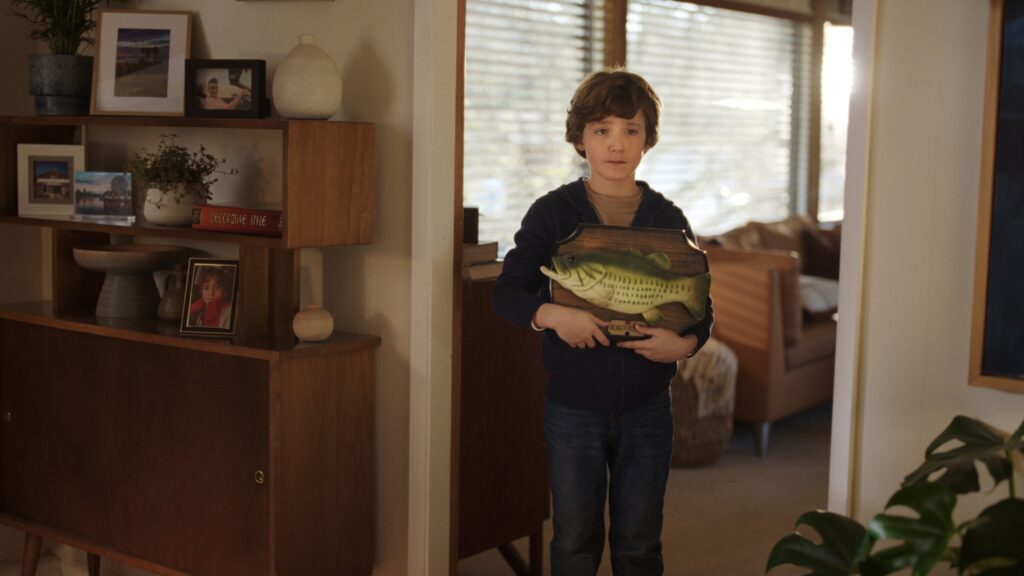 A child with Big Mouth Billy Bass.