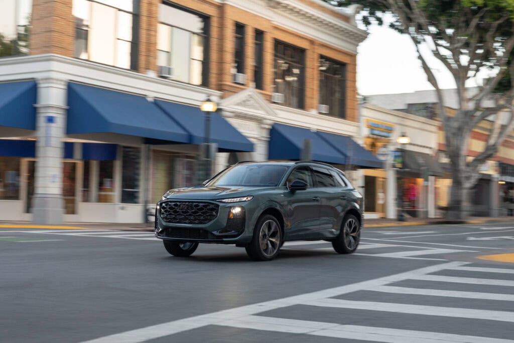 2026 Audi Q3 driving through an urban environment