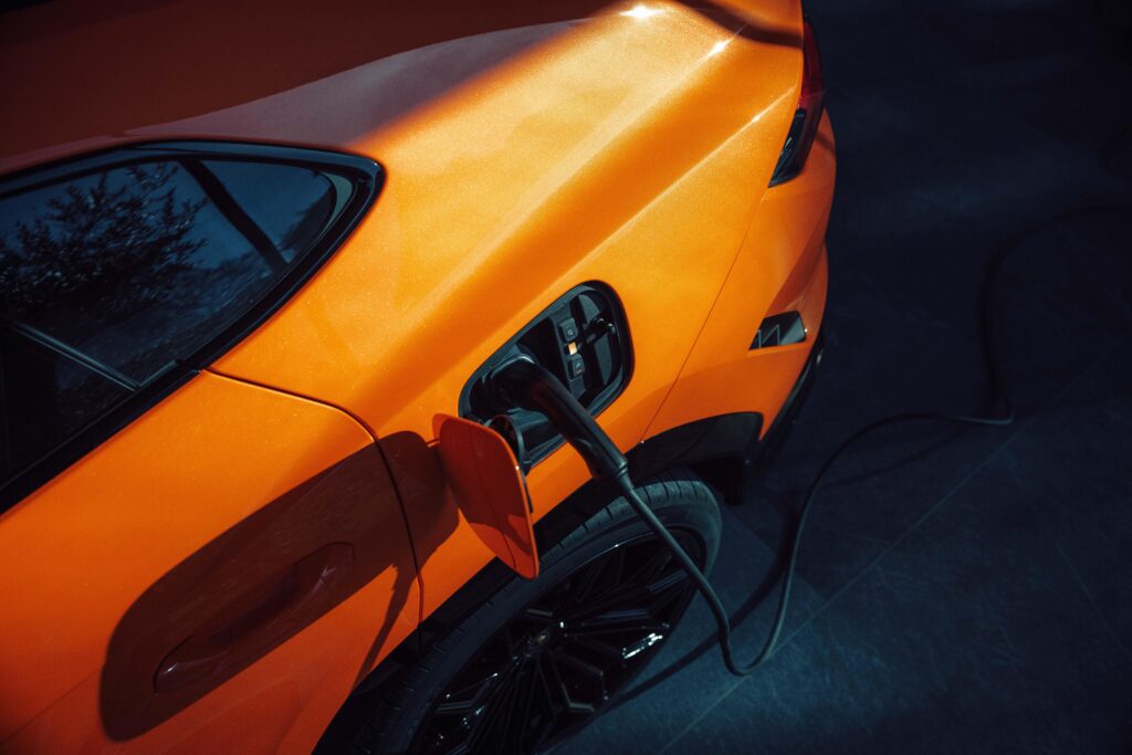 The Lamborghini Urus SE being plugged in to charge
