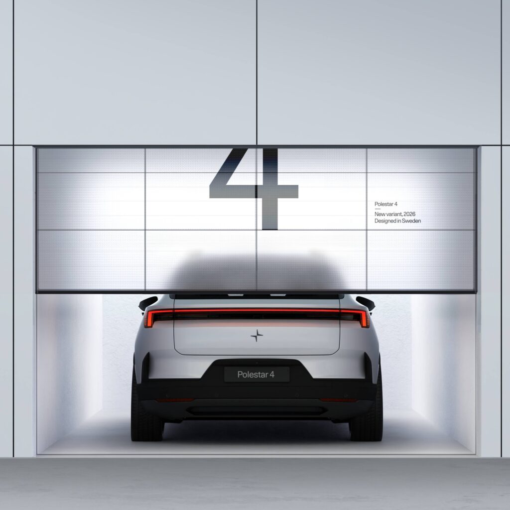 Polestar 4 behind the garage door, which is opening with a number four on it