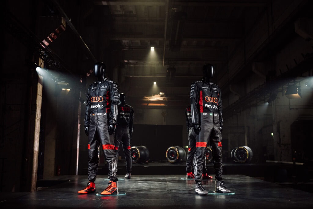 Two 2026 Audi Revolut F1 Team Racing Suits fitted on mannequins to show how they would look on their drivers 