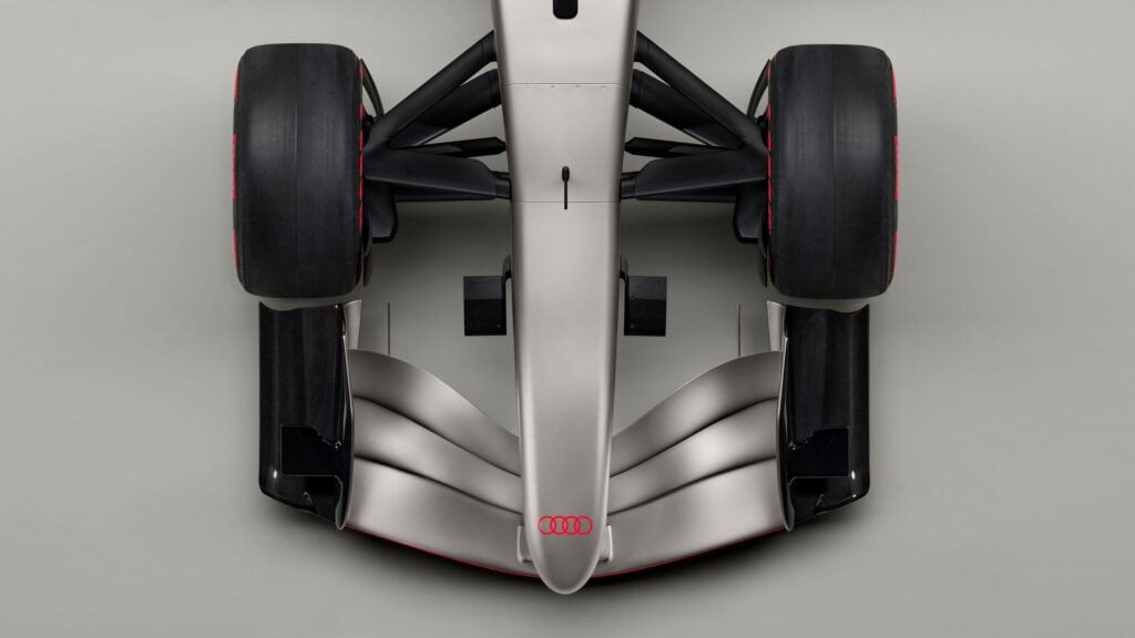 Indoor studio shot, exterior, bird’s-eye view, detail of wheel suspension, nose, and front wing