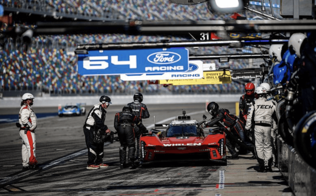 The No. 31 Action Express Racing Cadillac of Jack Aitken, Earl Bamber, Frederik Vesti and Connor Zilisch pits during the Rolex 24 at Daytona.