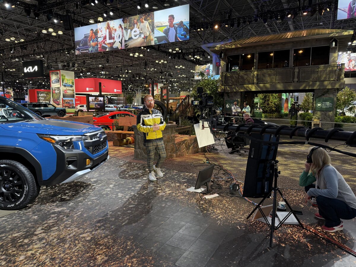 Nik Miles doing live TV on the Floor on the NY Auto Show