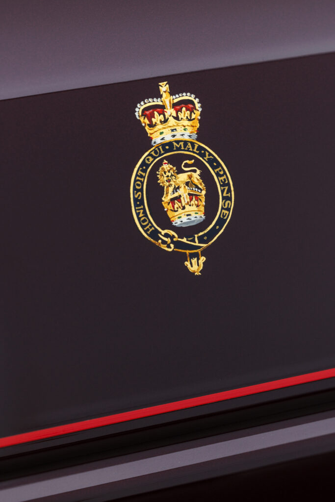 Queen is Elizabeth the second royal insignia on the doors of one of her Landrover's in the royal fleet