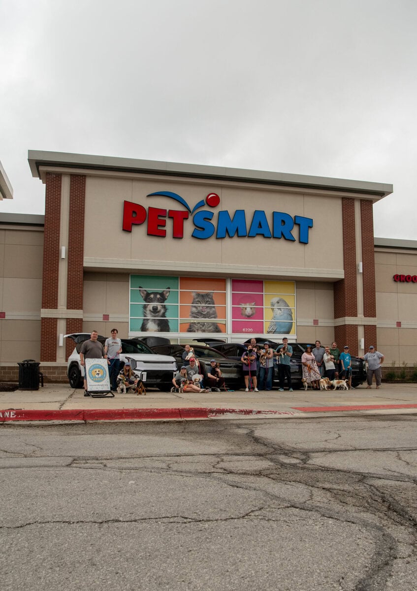 Operation photo the drivers and the dogs along with their rides for over 1800 miles assemble outside the PetSmart in Omaha, Nebraska ready for the journey West