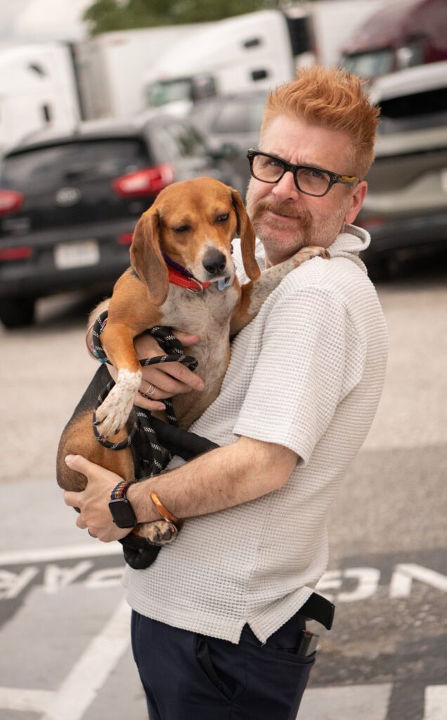 Nik Miles holds one of the dogs on this year's Operation Frodo EV