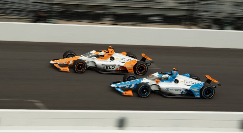 Two Indy Car's drive side by side during Final Practice of the Indy 500