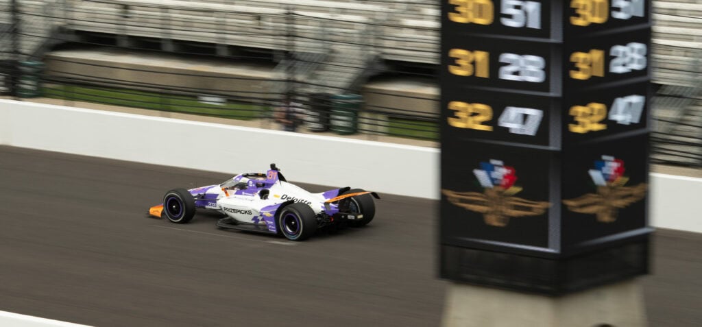 An Indy Car crossing the pole at the Indy 500