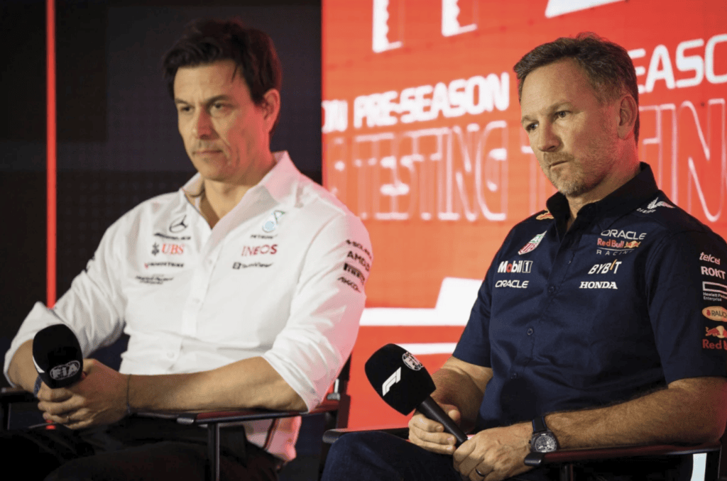 Toto Wolf and Christian Horner sitting at a press conference