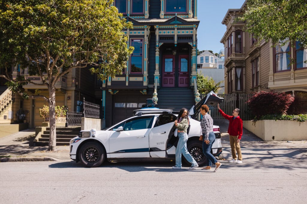 Waymo on the streets of San Francisco picking up people